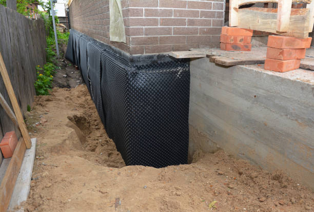SJ Waterproofing Pros technician performing targeted Vapor Barrier Installation assessment in Macy, IN